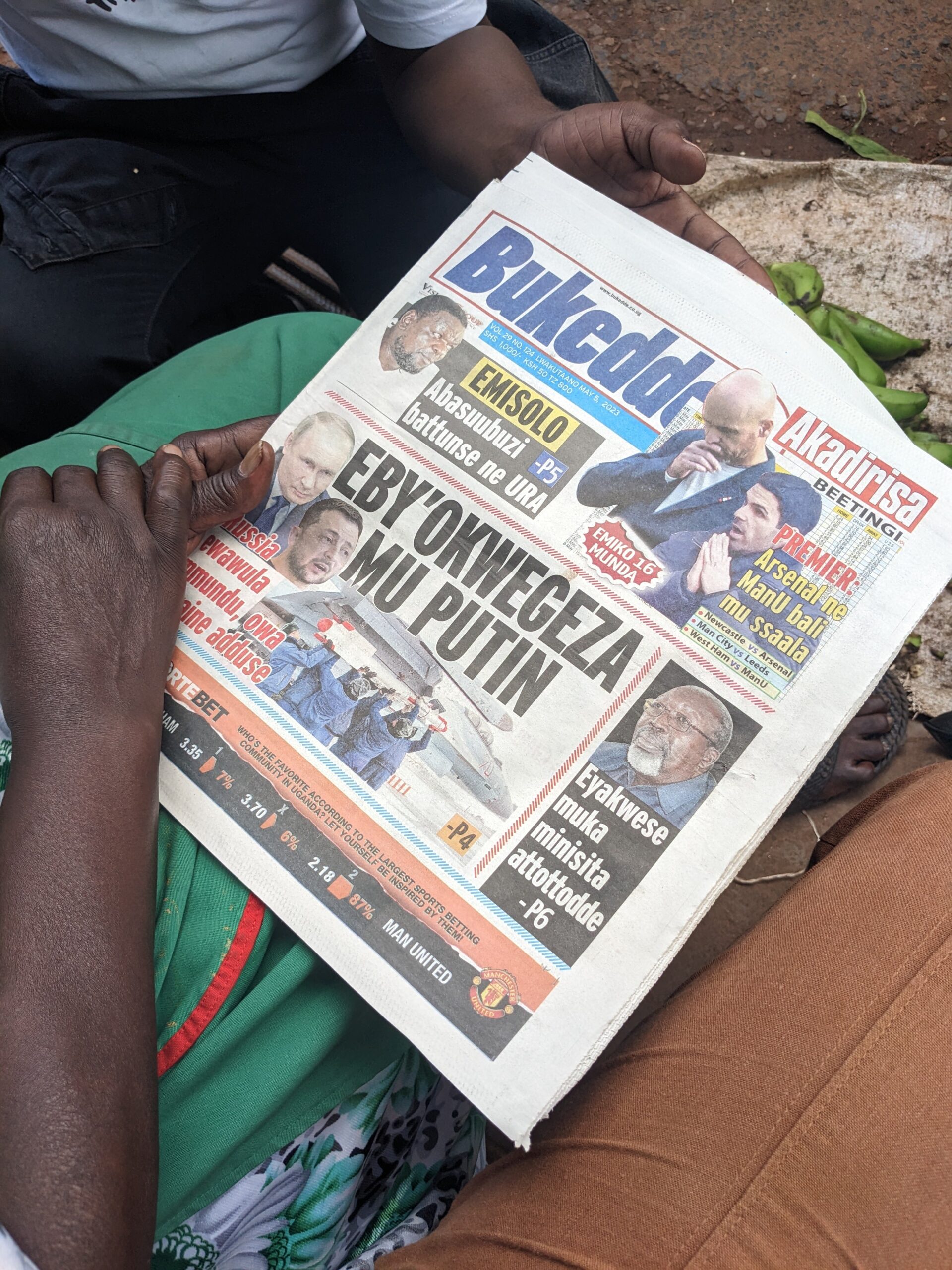 Doll conducting fieldwork in 2023, standing outside a taxi park in Kampala, capital of Uganda.