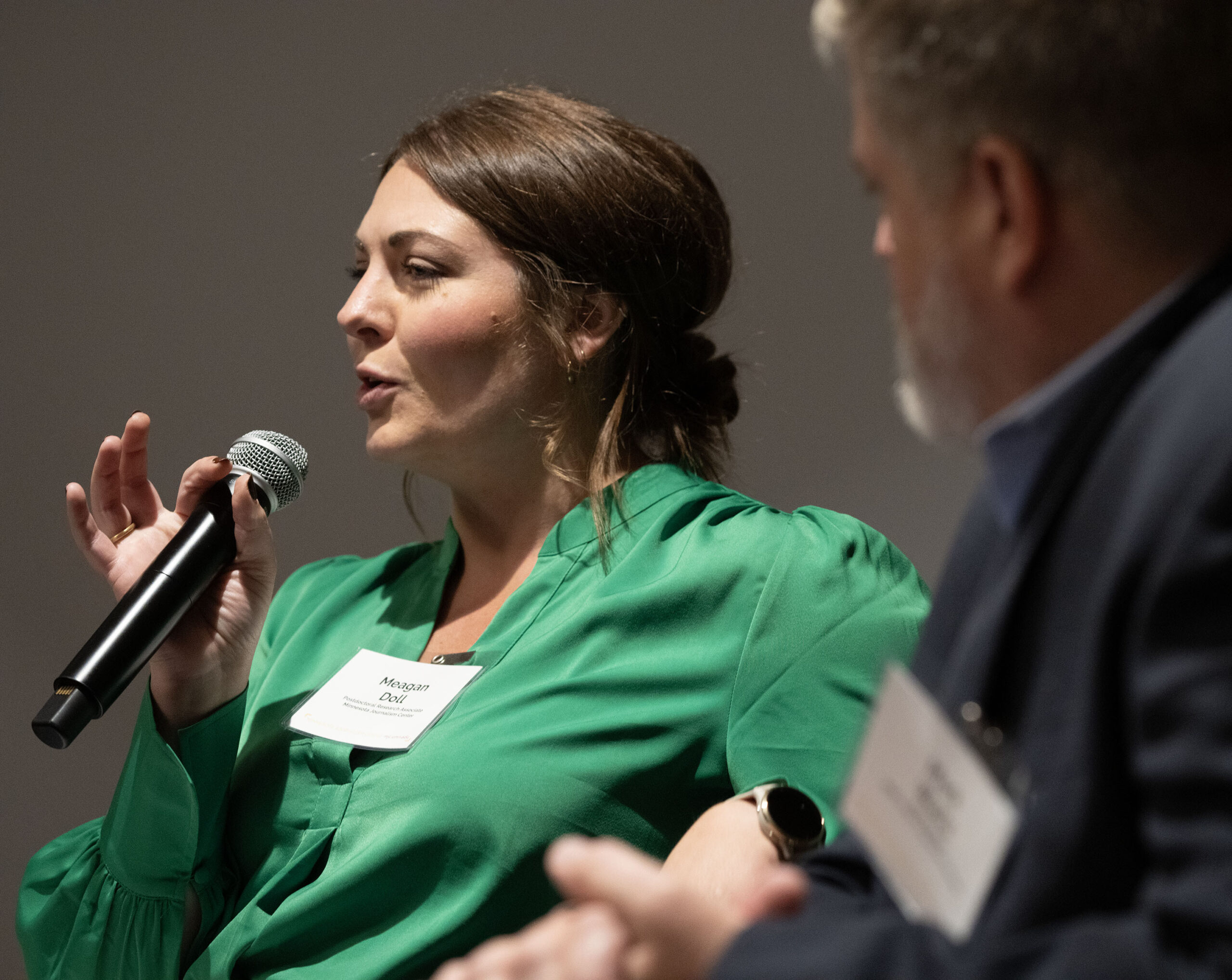 Doll speaking at a University of Minnesota symposium titled “The Future of State and Local Opinion Research” on Sept. 19, 2025.